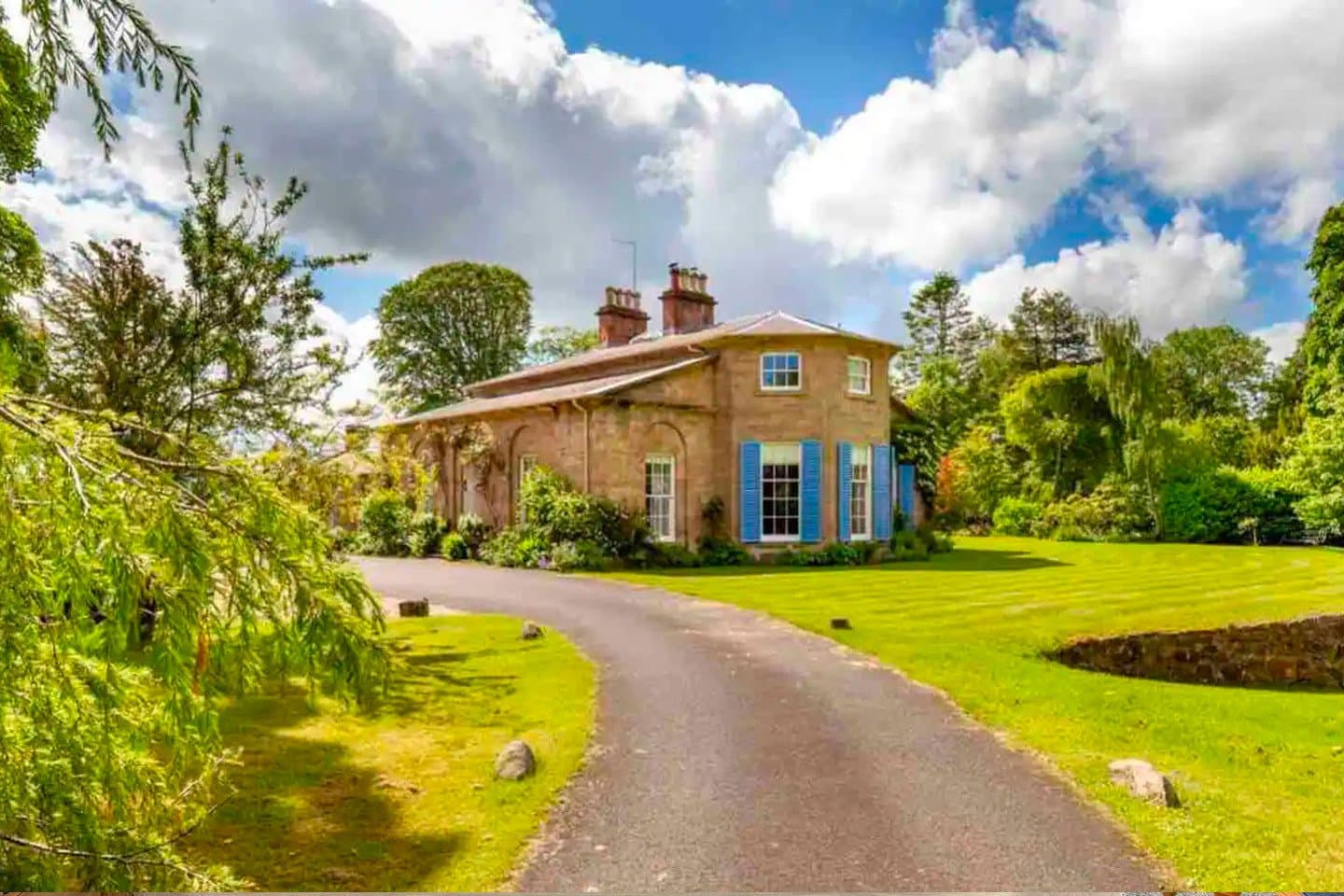 Petite Chateau manor house with blue shutters
